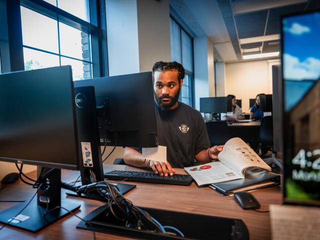Student working on a computer in the lab.