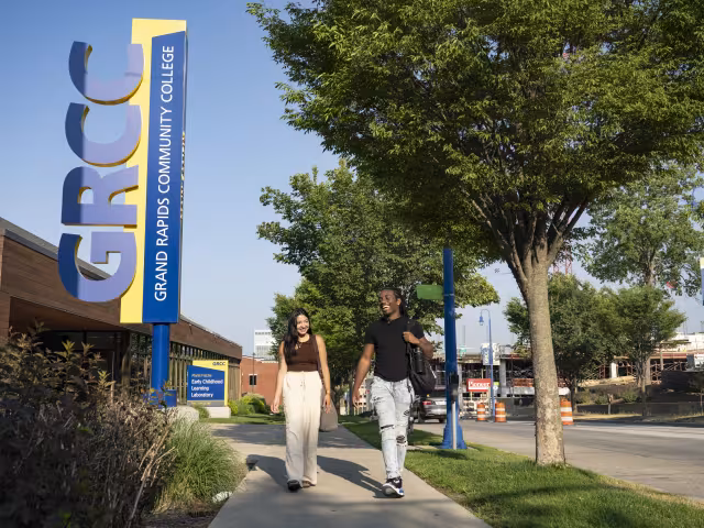 Two students walk past the GRCC Early Childhood Learning Laboratory.