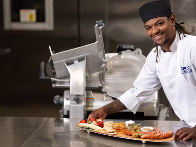 Culinary student preparing a platter of food