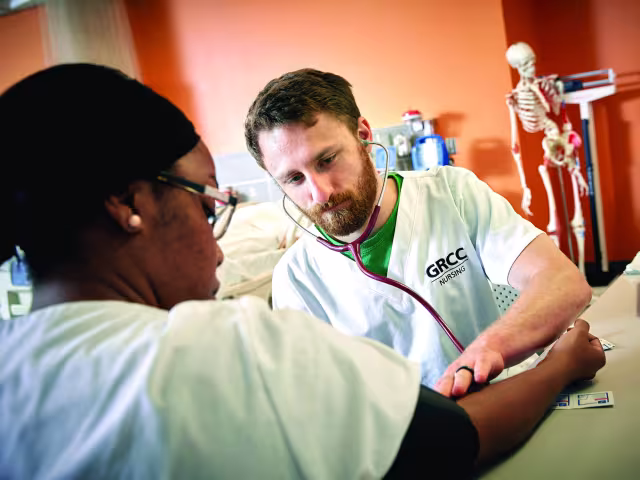 Nursing students taking blood pressures