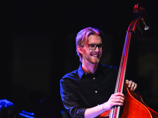 Student playing a cello