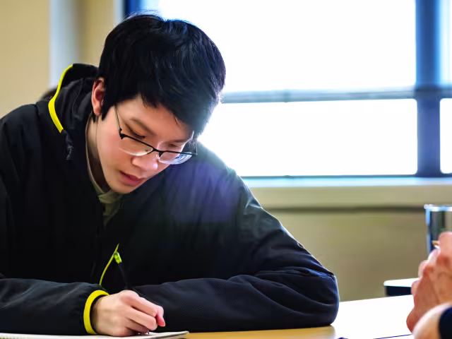 Student working on a project in a classroom