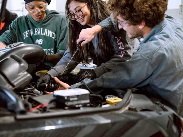 Student working on a car